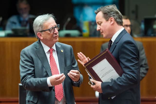 Cameron talks to EC president Juncker. Picture: AP