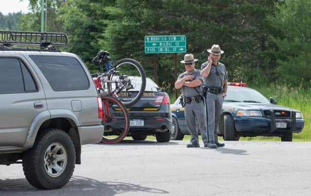 New York State Police officers man a roadblock on Highway 30. Picture Getty