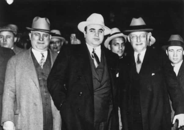 Al Capone, centre, in 1930. Picture: Getty