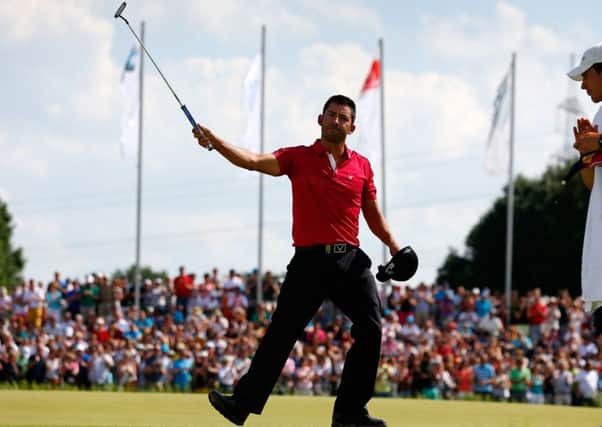 Munich winner Pablo Larrazabal acknowledges the crowd on the 18th hole after his 66. Picture: Getty