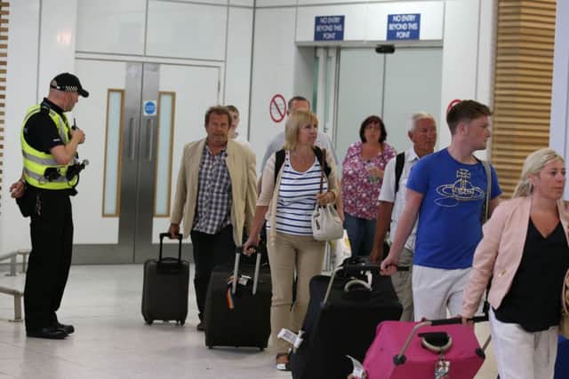 Passengers arrived back at Glasgow Airport after returning on a flight from Tunisia. Picture: PA