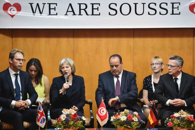 Home Secretary Theresa May, third left, attends a press conference with Tunisia's Interior Minister Mohamed Gharsall. Picture: Getty Images