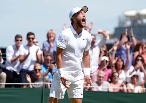 British wild card Liam Broady roars with delight as he seals victory over Marinko Matosevic. Picture: PA