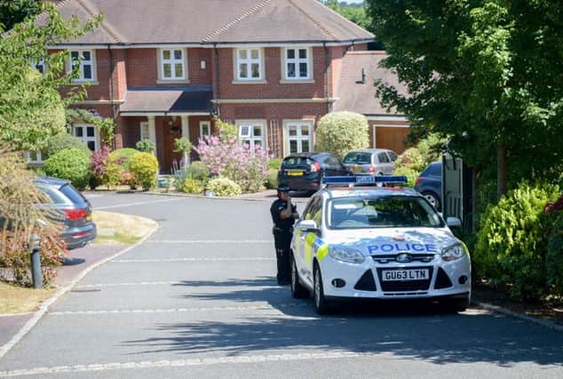 Police at Simmons Gate in Esher, Surrey, where bodies of a mum and daughter were discovered. Picture: SWNS