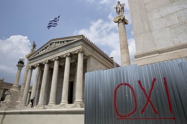 The word 'No' is spray-painted near the Athens Academy. Picture: AP