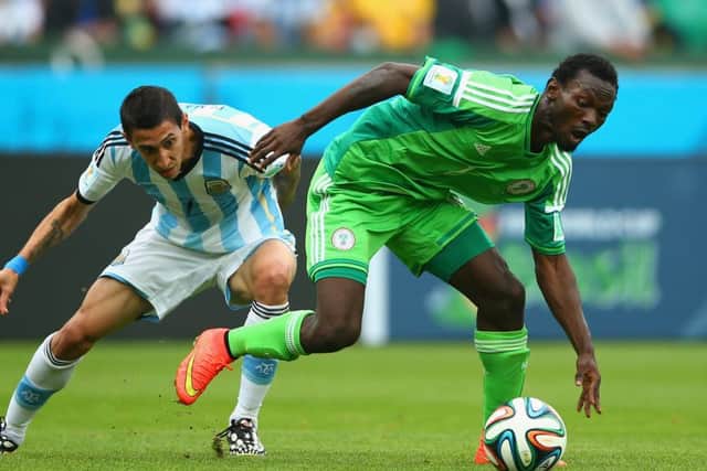 Juwon Oshaniwa, right, battling with Angel Di Maria at last year's World Cup. Picture: Getty