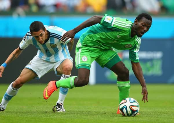 Juwon Oshaniwa, right, battling with Angel Di Maria at last year's World Cup. Picture: Getty