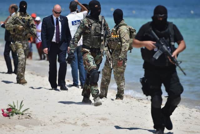 Armed guards have been patrolling Marhaba beach in recent days. Picture: Getty