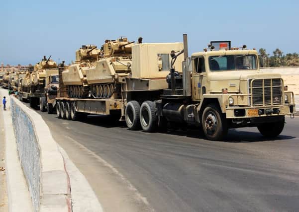 Trucks transport tanks in Egypt's northern Sinai Peninsula. Picture: AP