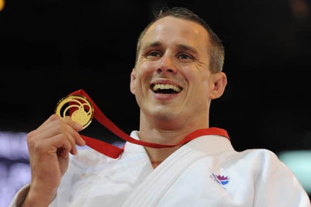Euan Burton was the flag bearer for Scotland at the 2014 Commonwealth Games. Picture: Neil Hanna