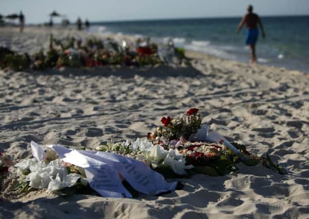 Tributes remain on the beach near the RIU Imperial Marhaba hotel in Sousse, Tunisia. Picture: PA