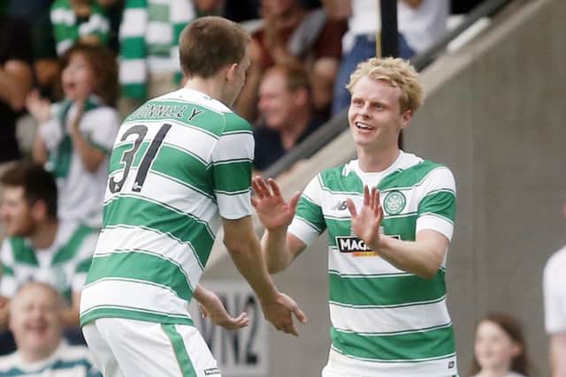Celtic's Gary Mackay-Steven (right) celebrates with Luke Donnelly after Pantophlet Kadeem's own goal. Picture: PA