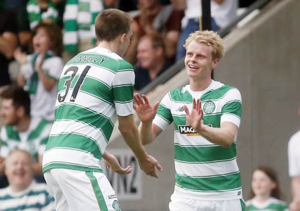 Celtic's Gary Mackay-Steven (right) celebrates with Luke Donnelly after Pantophlet Kadeem's own goal. Picture: PA