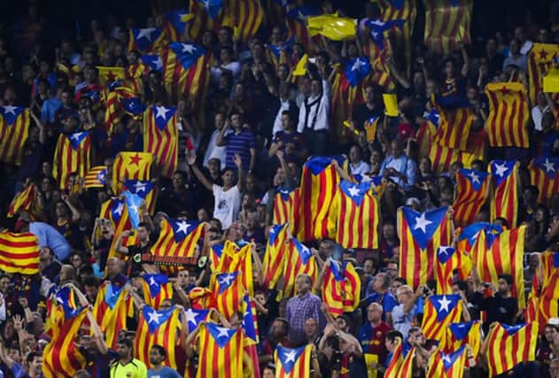 Barcelona fans wave 'Estelada' flags during a match against Real Madrid. Picture: Getty