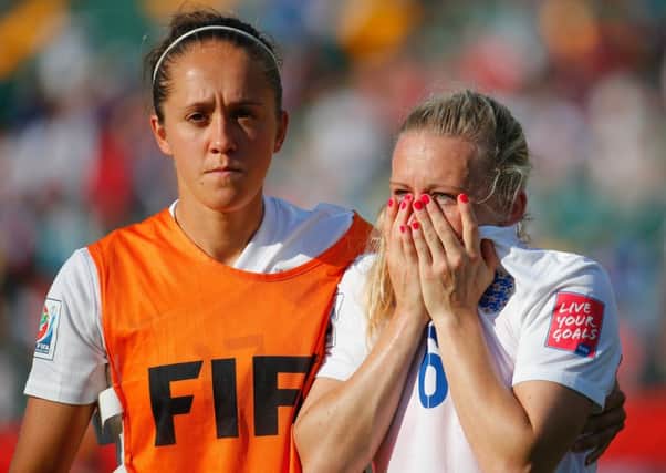 Laura Bassett of England is comforted by Jo Potter after their side was eliminated. Picture: Getty