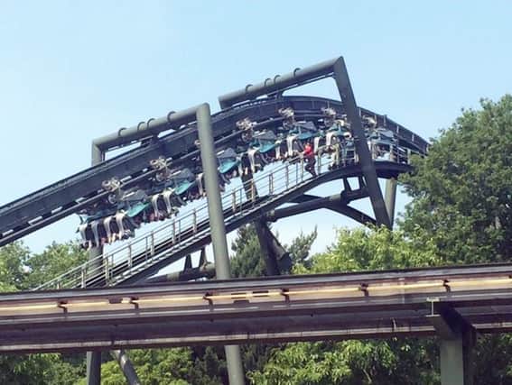 Dozens of people were left hanging upside down in mid-air for twenty minutes after a ride at Alton Towers malfunctioned on the hottest day of the year. Picture: SWNS