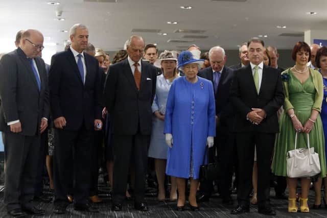 Queen Elizabeth II and the Duke of Edinburgh stand during a tour of Strathclyde University's Technology and Innovation Centre as Britain remembers the victims of the Tunisia terror attack with a minute's silence. Picture: PA