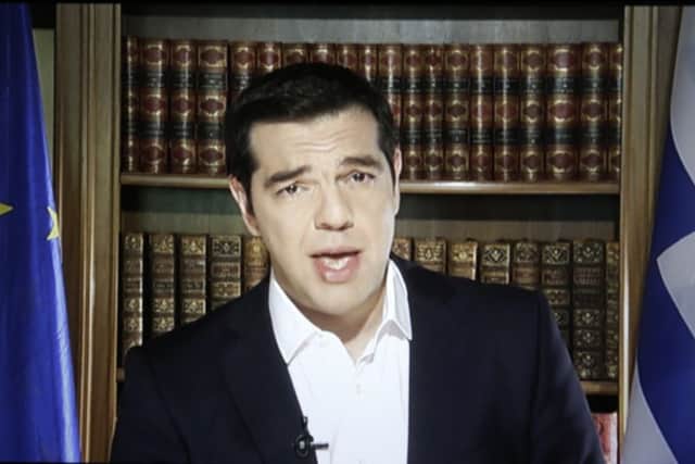 Tsipras delivers his televised message yesterday. Picture: AP