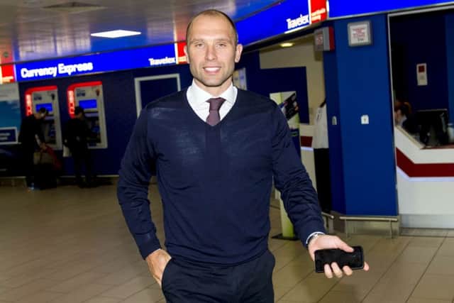 John Eustace at Glasgow Airport prior to talks with Rangers early last week. Picture: SNS