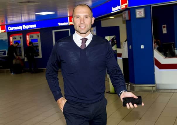 John Eustace at Glasgow Airport prior to talks with Rangers early last week. Picture: SNS