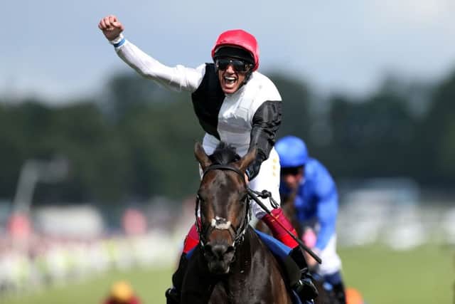 Frankie Dettori punches the air in delight after steering Golden Horn to victory in the Epsom Derby. Picture: Getty
