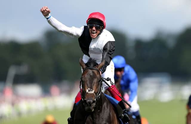 Frankie Dettori punches the air in delight after steering Golden Horn to victory in the Epsom Derby. Picture: Getty