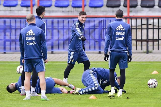 Lionel Messi jokes with his teammates during an Argentina training session. Picture: Getty