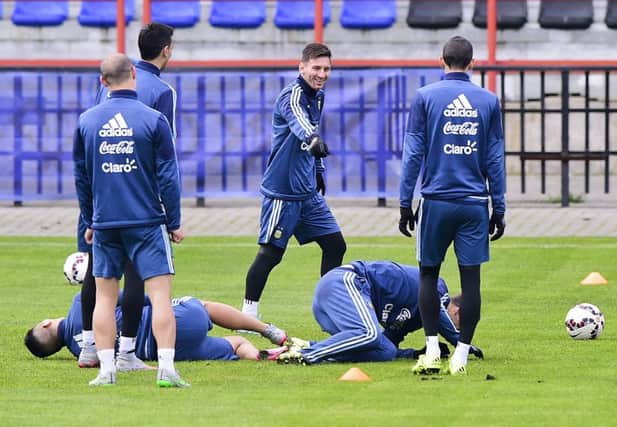 Lionel Messi jokes with his teammates during an Argentina training session. Picture: Getty