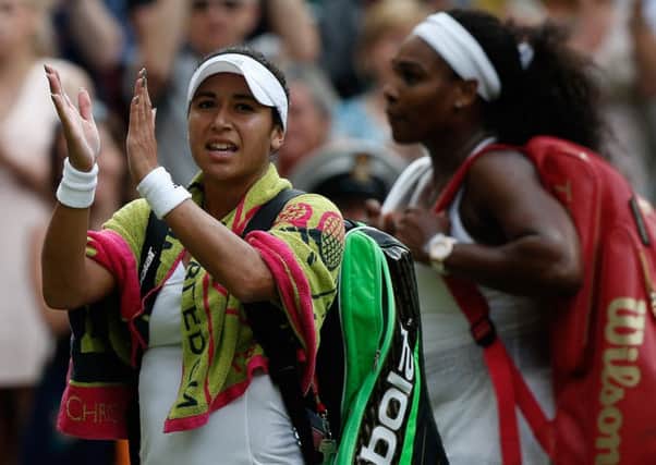 Britain's Heather Watson (L) applauds the crowd as she leaves the court following her defeat to Serena Williams. Picture: AFP/Getty