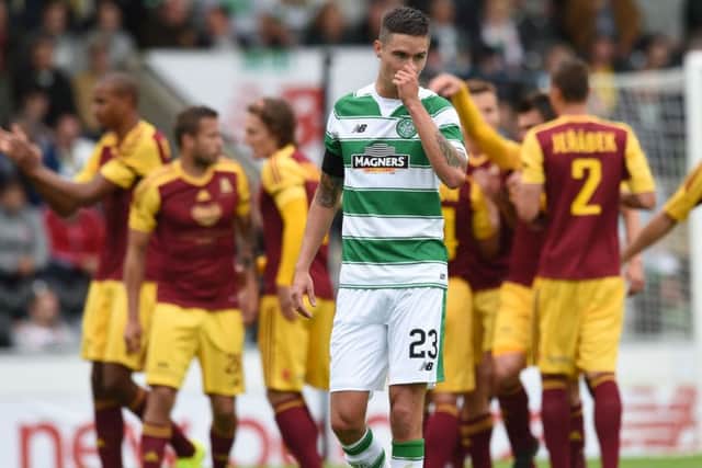 Celtic defender Mikael Lustig heads back into position as Dukla Prague celebrate behind him. Picture: SNS