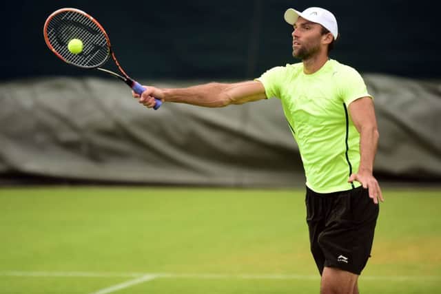 Ivo Karlovic practises at Wimbledon yesterday. Picture: PA
