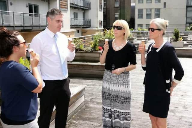 Newton Property staff enjoy the heat. Picture: SWNS
