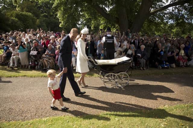 The family leave the church after the christening. Picture: AP