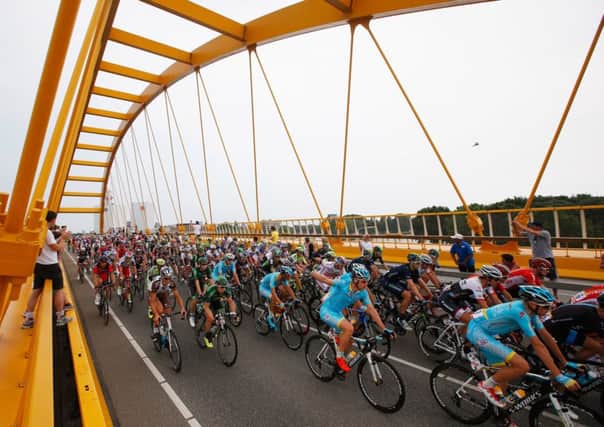 The peloton crosses a bridge during stage two of the Tour de France, a 166km stage between Utrecht and Zelande. Picture: Getty