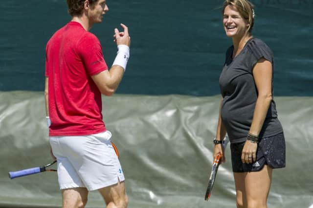Andy Murray shares a joke with his coach Amelie Mauresmo. Picture: Ian Rutherford