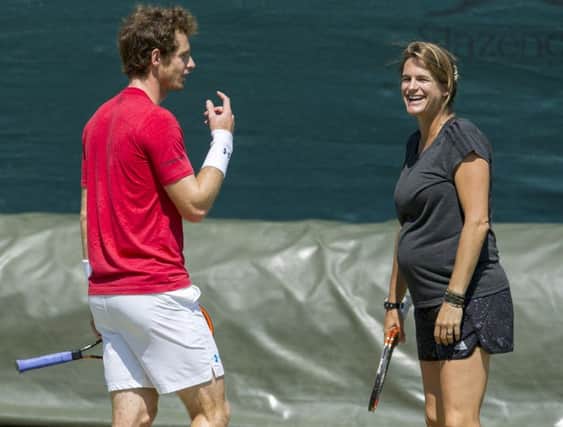 Andy Murray shares a joke with his coach Amelie Mauresmo. Picture: Ian Rutherford