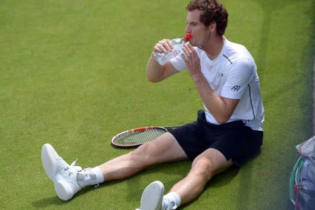 Andy Murray takes on water during a practice session ahead of his fourth round encounter. Picture: PA