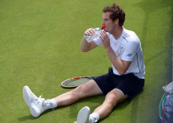 Andy Murray takes on water during a practice session ahead of his fourth round encounter. Picture: PA