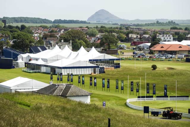 North Berwick Law stands out in the distance against the backdrop of the tented village at Gullane. Picture: Jane Barlow
