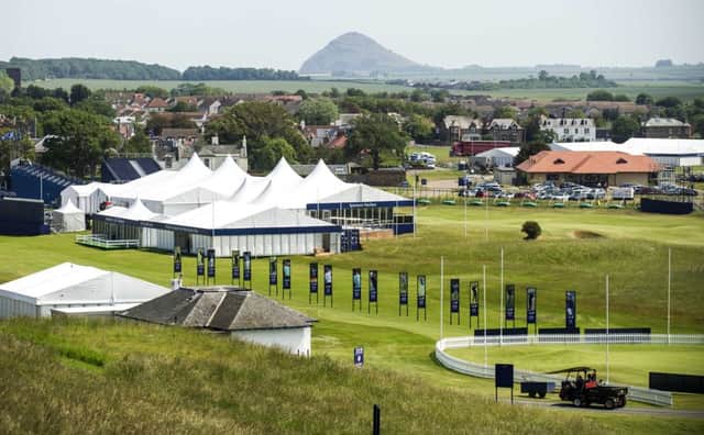 North Berwick Law stands out in the distance against the backdrop of the tented village at Gullane. Picture: Jane Barlow