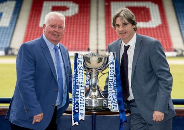 Former Rangers star Alex MacDonald and ex-Clyde player Joe Miller helped make the League Cup draw at Hampden yesterday. Picture: SNS
