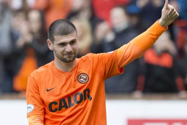 Nadir Ciftci salutes the home fans after what could be his final game for Dundee United. Picture: SNS