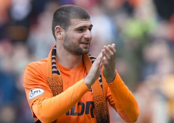 Nadir Ciftci salutes the United fans after what could prove to be his final game for the club, a 3-0 victory over Dundee. Picture: SNS