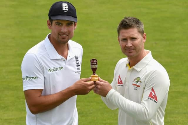 Captains Alastair Cook and Michael Clarke pose with the urn on the eve of the Ashes. Picture: Getty