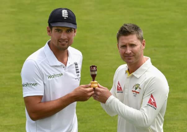 Captains Alastair Cook and Michael Clarke pose with the urn on the eve of the Ashes. Picture: Getty
