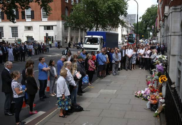People pay tribute to victims of the bus bombing near Tavistock Square. Picture: Getty