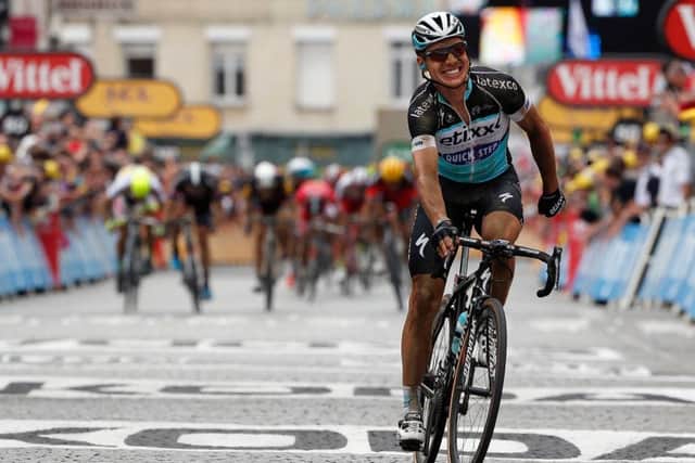 A grinning Tony Martin crosses the line in Cambrai to take the stage win and yellow jersey. Picture: Getty