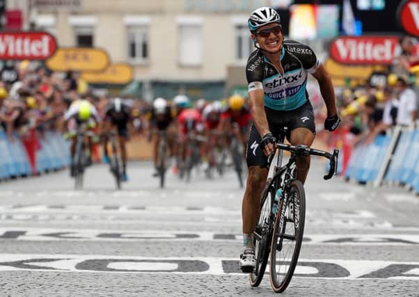 A grinning Tony Martin crosses the line in Cambrai to take the stage win and yellow jersey. Picture: Getty