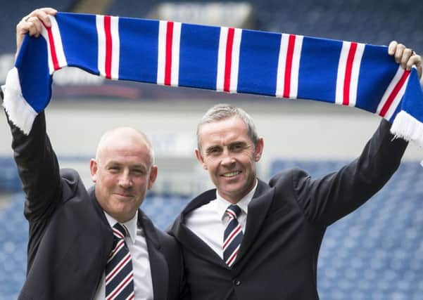 Davie Weir, right, with Mark Warburton, has admitted Rangers' lack of a scouting network is hampering recruitment efforts. Picture: PA