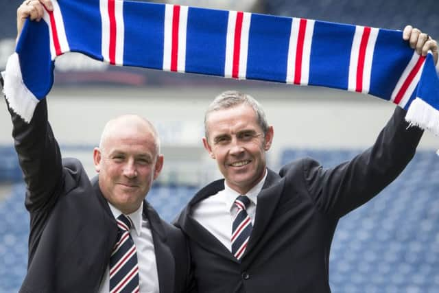 Davie Weir, right, with Mark Warburton, has admitted Rangers' lack of a scouting network is hampering recruitment efforts. Picture: PA